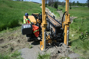 A Directbore employee operating the Horizontal Directional Drill